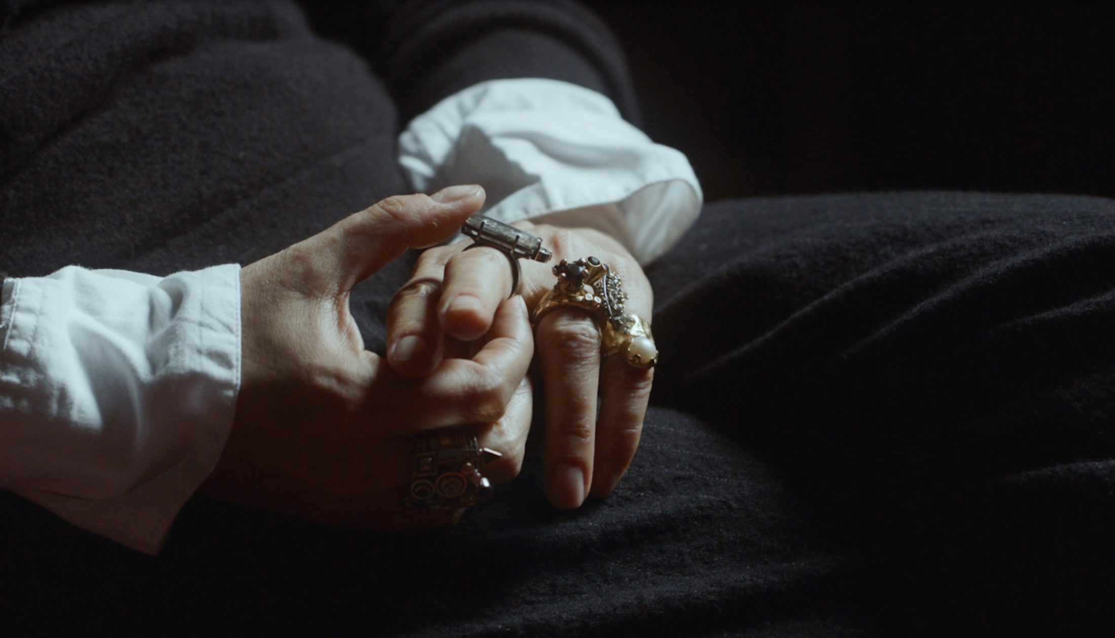 Image of someone holding bespoke jewellery